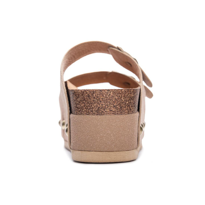 A pair of beige vegan suede platform sandals with buckle closure and a cork-like texture, displayed against a white background.